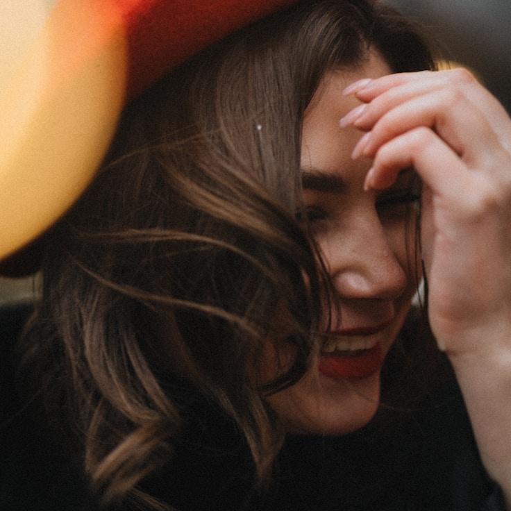 Alex Monroe, Lead Design Curator at Crest Garden Book, reviewing corporate floral arrangements